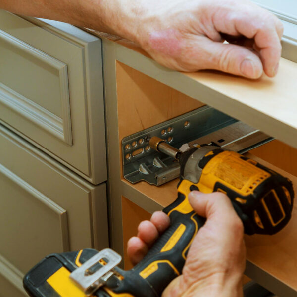 Adjusting-fixing-cabinet-door-hinge-adjustment-on-kitchen-cabinets-600x600